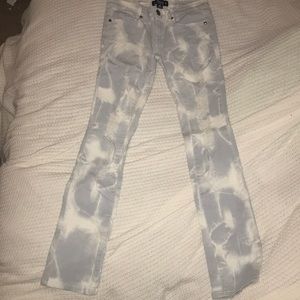 Abbey Dawn distressed acid wash skinny jeans.